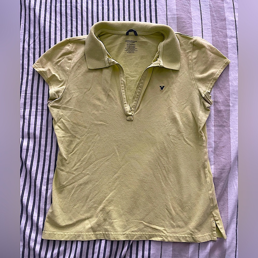 Vintage Abercrombie polo shirt with cap sleeves in a light green.
